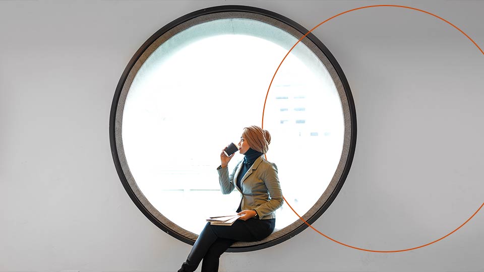 Woman sitting in circular window
