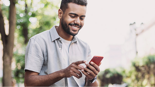 Man smiling at phone